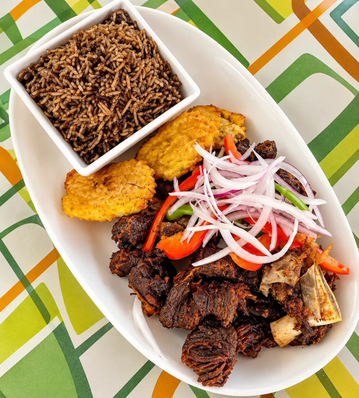 Goat and rice at Caribbean Latino Finger Licking Restaurant in Eastwood, Edmonton