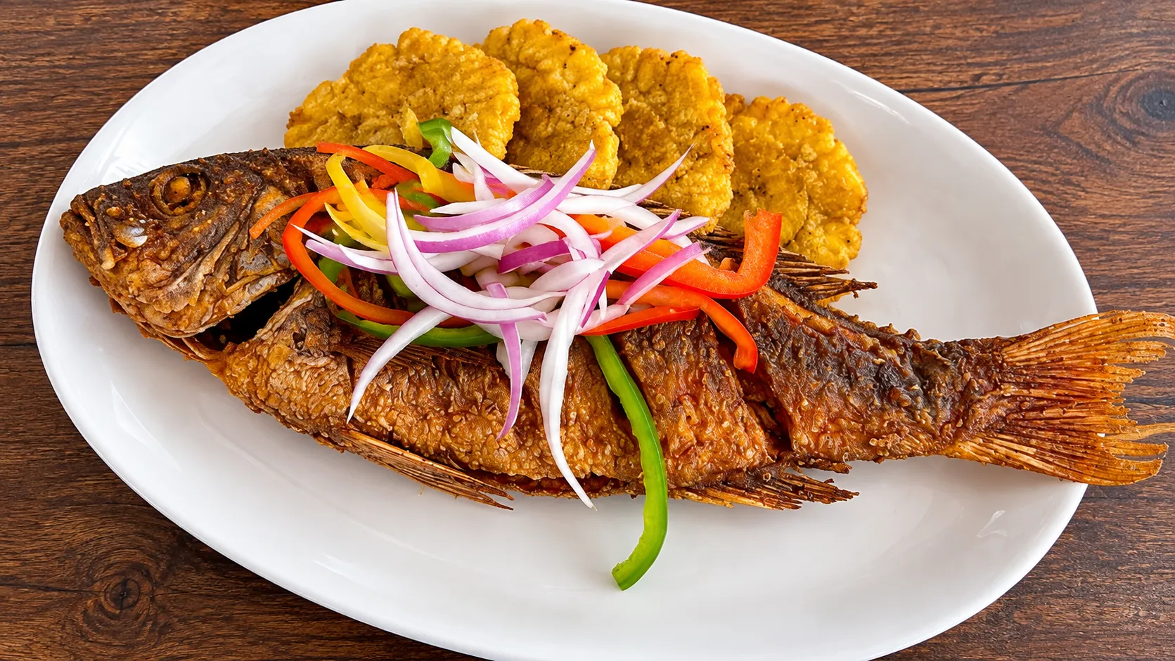 Fish (red snapper) and rice djondjon at Caribbean Latino Finger Licking Restaurant Edmonton